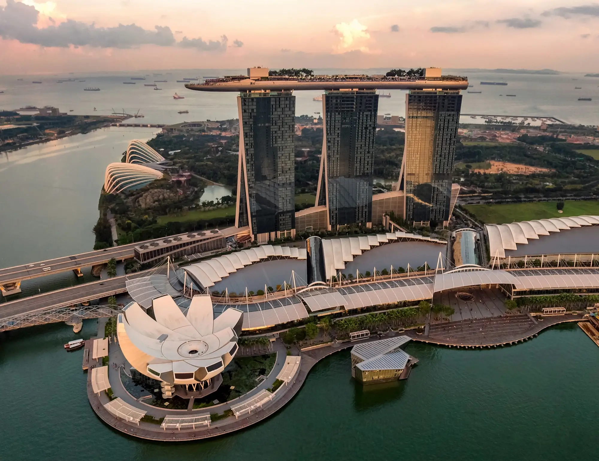 Singapore Marina Bay skyline at sunset with iconic buildings
